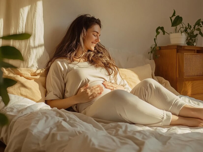 pregnant woman touching her belly