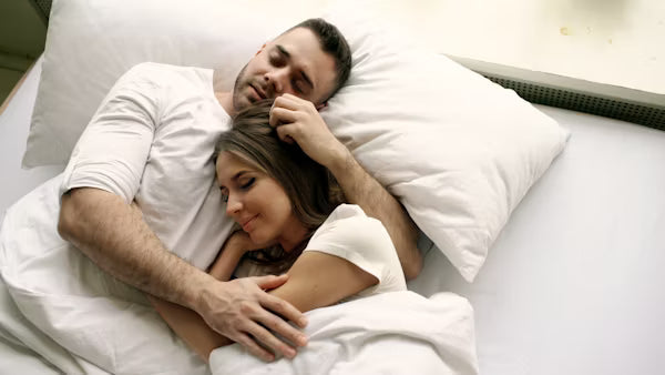 How to share a bed comfortably with a pregnancy pillow AND your partner